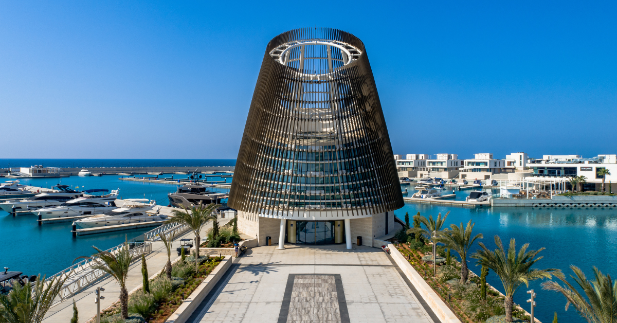 The impressive Event Center at Ayia Napa Marina with the glistening blue in the background
